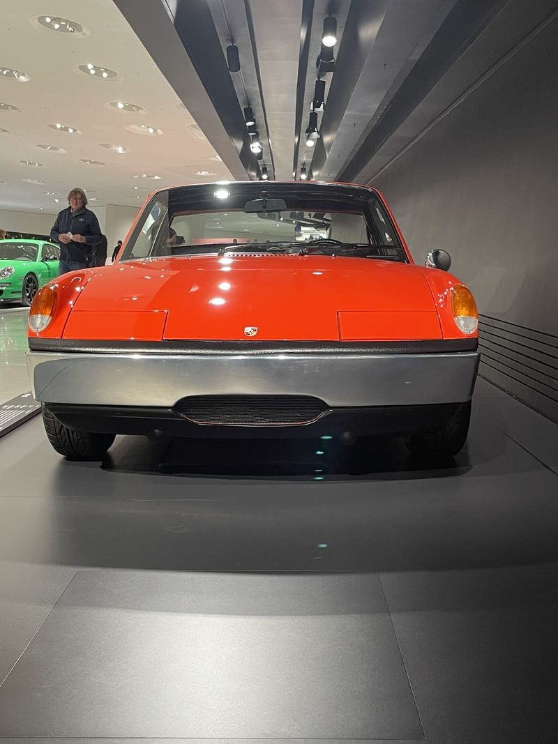 The orange Porsche 914-8, the original eight-cylinder 914 prototype, on display at the Porsche Museum