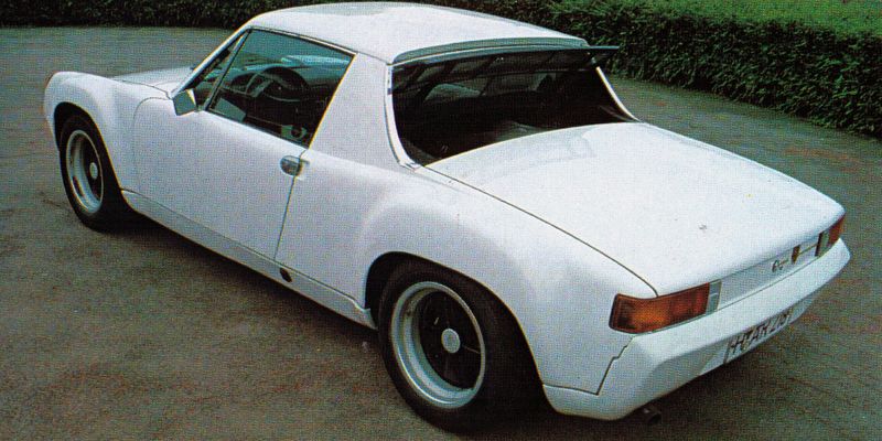 Original factory Porsche 916 in white, rear three-quarter view showing the welded steel roof and flared fenders